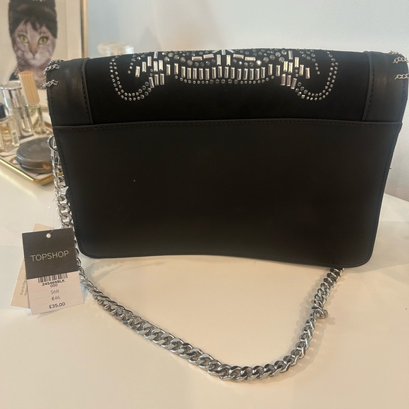 “The one with the Tiger handbag” - Picture 3 of 3